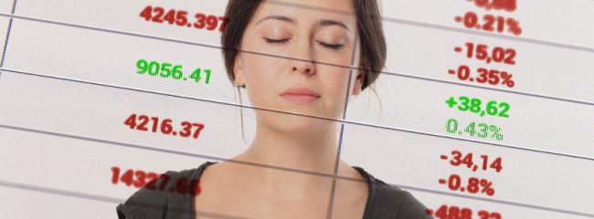 Woman with spreadsheet behind her