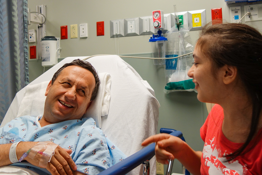 Little girl visits her father before surgery