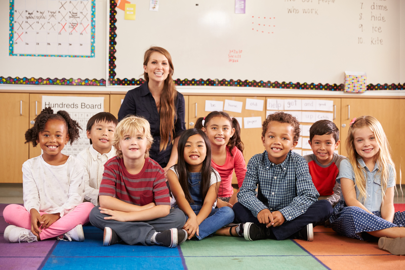 Students sitting with teacher